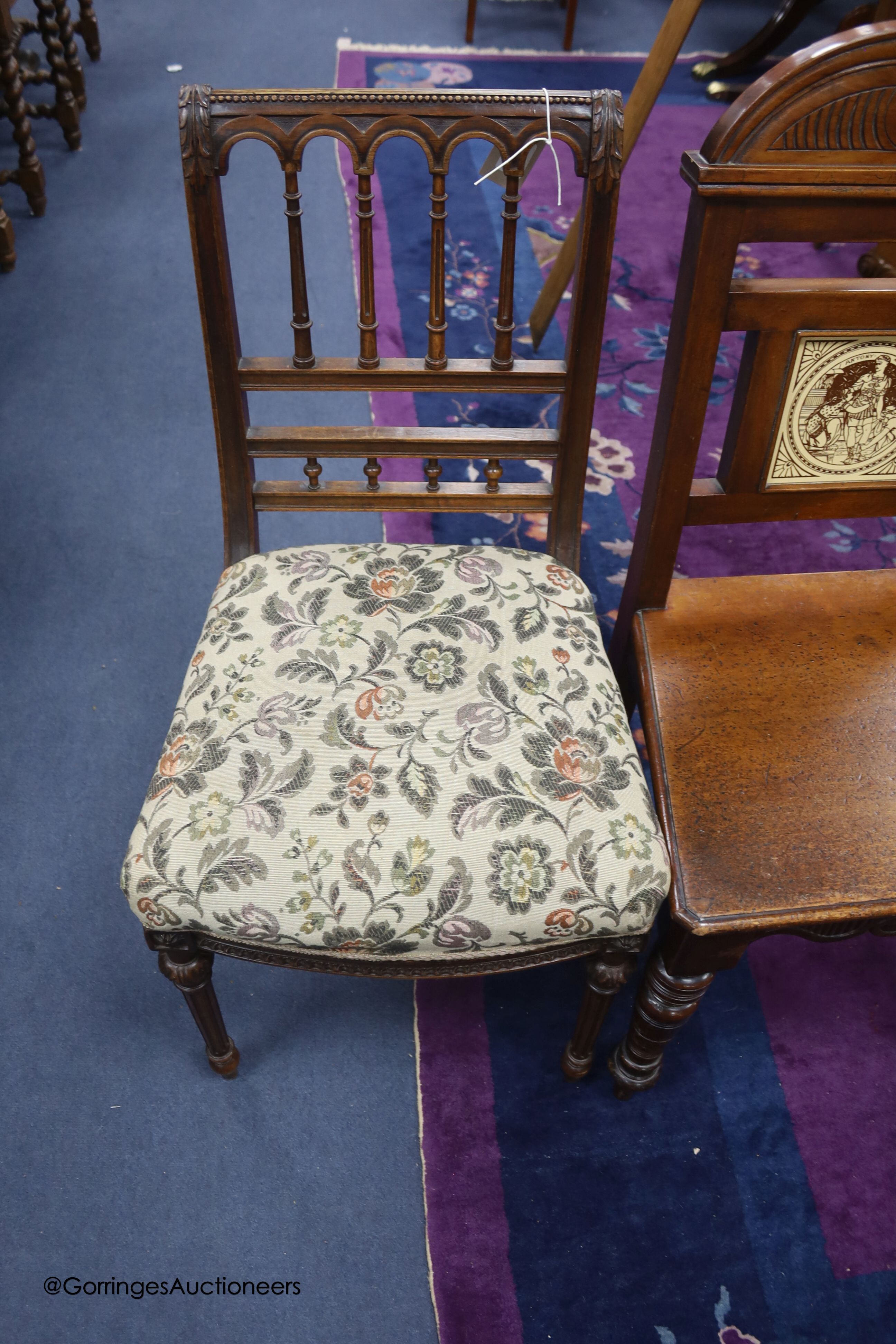 A late Victorian walnut hall chair with inset Minton tile and a Victorian walnut single chair.